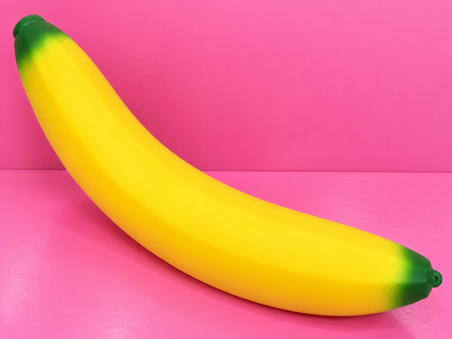 45cm Jumbo Banana Squishy on pink background
