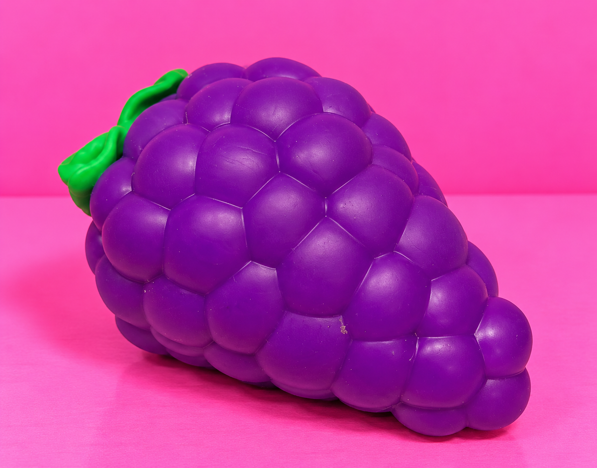Jumbo Grape Squishy on pink background