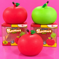 Red and green SoftMart scented apple squishies on pink background
