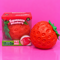 Jumbo Strawberry Squishy with box on pink background