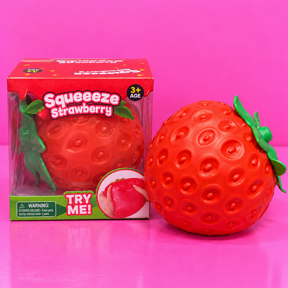 Jumbo Strawberry Squishy with box on pink background