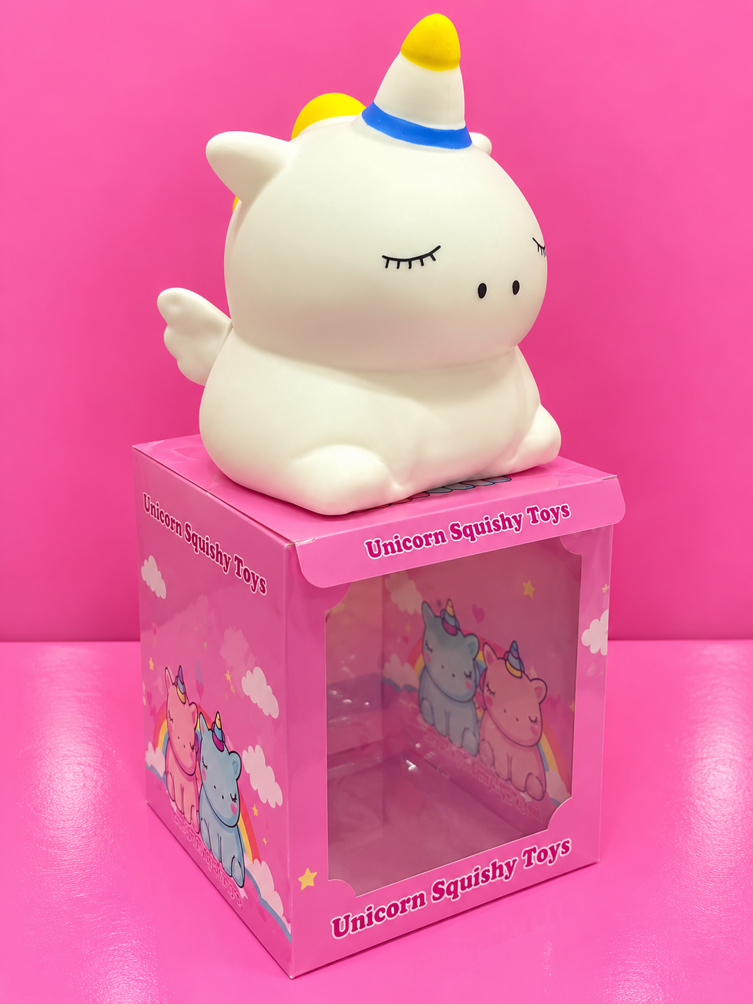 Jumbo Unicorn Squishy with pink box and pink background